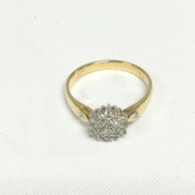 An 18ct gold diamond cluster ring, approx 3.5g, approx 1/4ct and approx size N. Shipping category A.