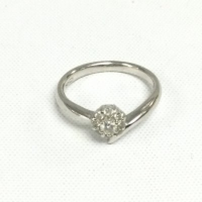 An 18ct white gold diamond cluster ring in the form of a flowerhead, approx 3.1g and approx size K. Shipping category A.