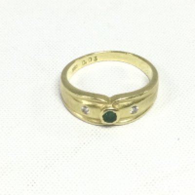 A 14ct gold ring set with an emerald and two diamonds, approx 3.8g and approx size N. Shipping category A.
