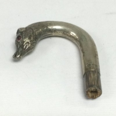 A silver topped cane handle. Shipping category A.