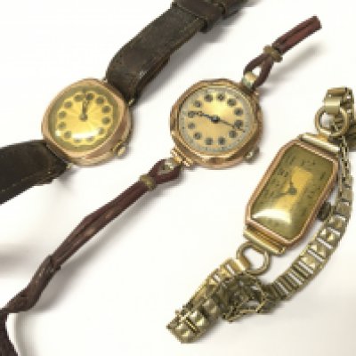 Two 9ct gold cased watches and a gold plated watch . Postage category A