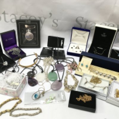 A box of costume jewellery including silver rings, a small 9ct gold chain, stone pendant necklaces etc. postage category B