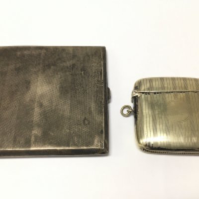 A silver plated vesta case and a silver hallmarked cigarette box . Postage category A