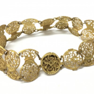 An Unusual necklace made from early pocket watch balance cocks . 17cm long . Postage category A