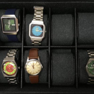 Watches including Seiko 5 automatic Arabic day/date, vintage Seiko 5 green face, Rone Gents wrist watch, Vintage Seiko Emerald green TV dial and a Seiko Automatic Mikey Mouse face Japan made watch. Stored in a watch case. Postage category B