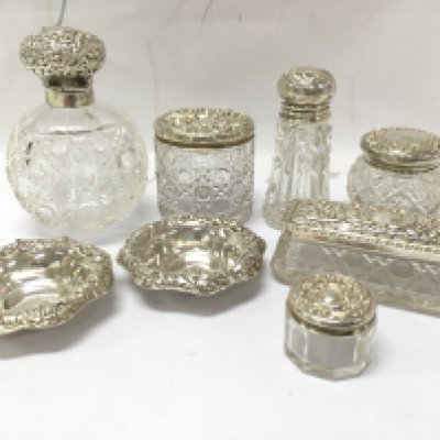 A collection of Six Silver hallmarked topped tidy jars and a pair of small silver dishes