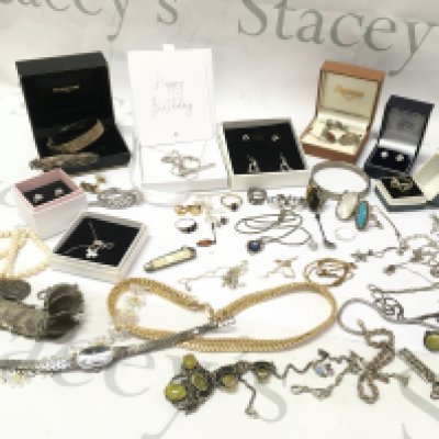 A large collection of jewellery mostly silver including necklaces, bangles , earrings etc . Postage category B
