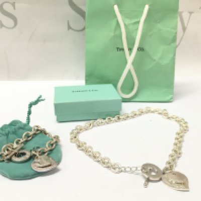 Boxed silver Tiffany & Co bracelets. Postage category A