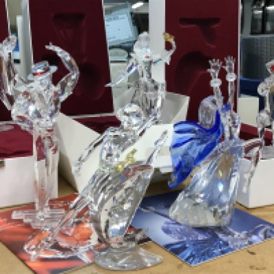 A Collection of Swarovski Masquerade figures including Columbine, Harlequin, Antonio, Isidora and Anna- all boxed