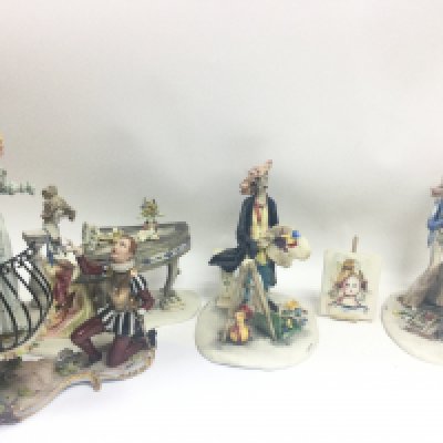 A collection of Italian porcelain figures including a Capodimonte Romeo and Juliet figure group and E Tezza figures. This lot cannot be posted.