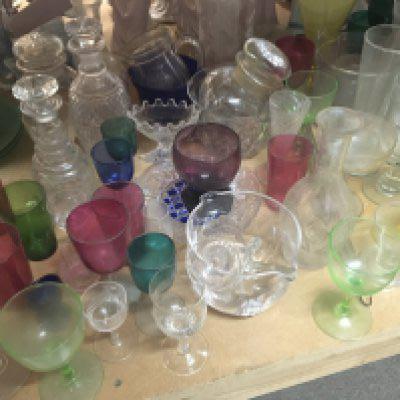 A large collection of interesting glass early 19th century and later including glass mixing bowls coloured glass decanters etc.