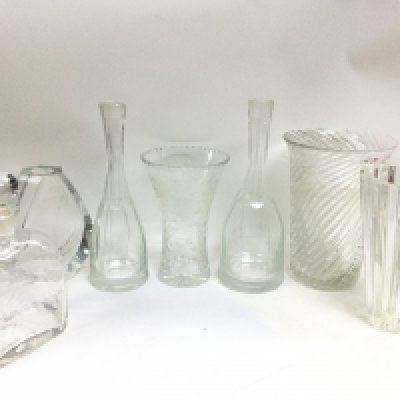 A collection of cut glass vases including Atlantis, Baccarat and others. 18 to 29cm tall. This lot cannot be posted