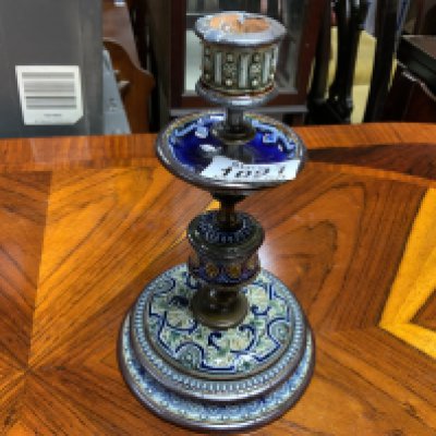 A Doulton Lambeth candle stick. Postage category D.