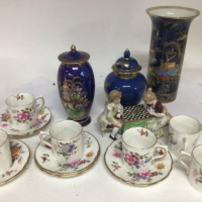 Three Carlton ware powder blue and lustre based decorated with gilt a royal crown Derby coffee set and a Continental porcelain figure group playing chess.