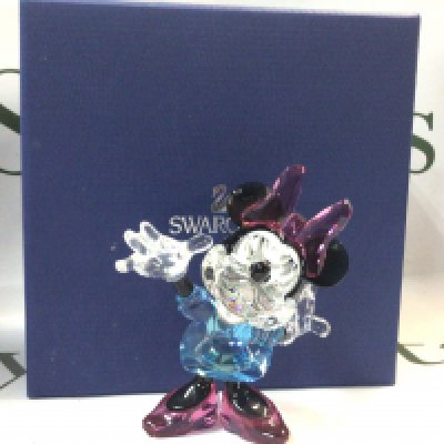 A boxed Swarovski Minnie Mouse crystal glass figure, coloured edition. 11cm tall. No obvious damage or restoration Postage category B