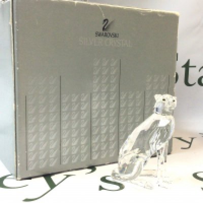 A boxed Swarovski Crystal Cheetah figure, 9cm tall. No obvious damage or restoration. Postage category B