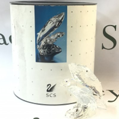 A boxed Dolphin crystal glass SCS 1992 Annual Edition Care for me the Whales figure group. No obvious damage or restoration 10cm tall. Postage category B