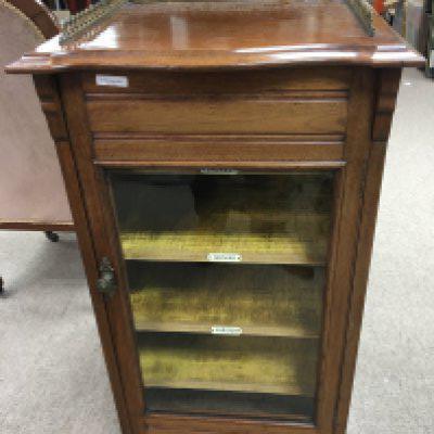 A walnut late Victorian music sheet cabinet the top with a raised three quarter gallery above a well fitted interior.