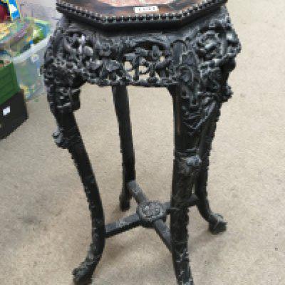 A late 19th century Chinese hardwood jardiniere stand with an inset marble top. Hight 77cm