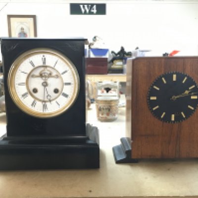 Two mantle clocks, slate and wooden. Dimensions 16x27x32cm & 10x29x28cm This lot cannot be posted