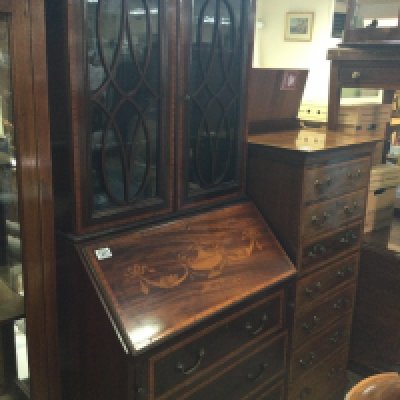 A small Edwardian inlaid mahogany bureau bookcase with a pair of glazed doors above a full front with three drawers under . 172 cm x 65 cm .