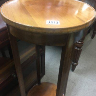 A mahogany jardiniere stand .