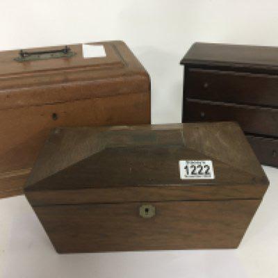 An Early Victorian rosewood tea caddy with a hinged top enclosing compartments a small flight of three drawers and one other box (3)