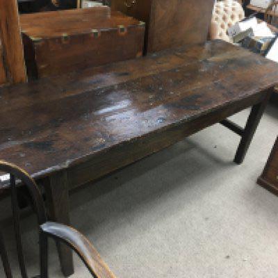 A 18 th century oak table the rectangle top above square tapering legs United by a stretcher. 190 cm x 70 cm .