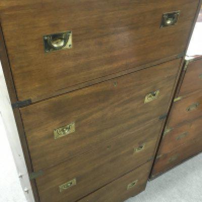 A campaign style brass bound chest of drawers fitted with four drawers
