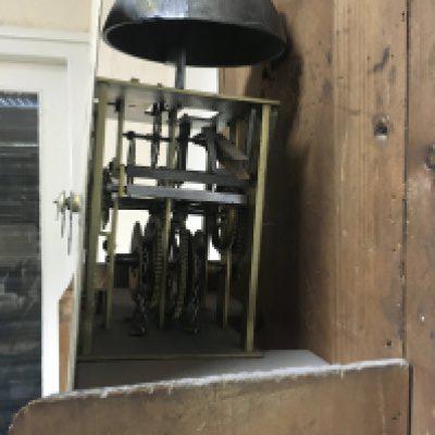 A oak 30 hour long oak long case clock the square dial with Roman numerals maker Thomas Harris .