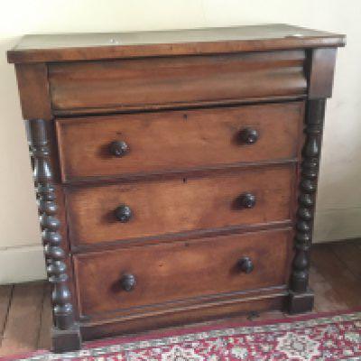 A Victorian mahogany chest of drawers fitted with a cushion drawer and three long drawers. Flanked by spiral pilasters 109x52cm height 114cm