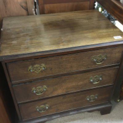 A small George III mahogany chest of drawers fitted with three drawers on bracket feet. 66cm high 45cm deep width 67cm.