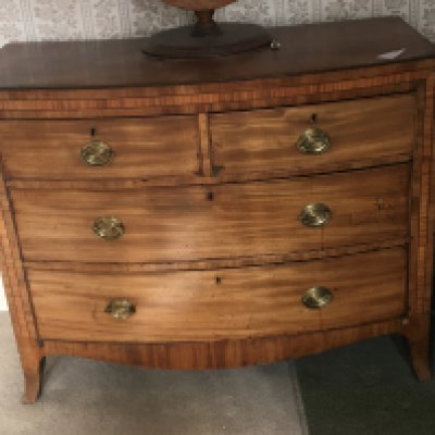 A late George III chest of drawers fitted with two short and two long drawers with satinwood banding and bracket feet. 107x52cm