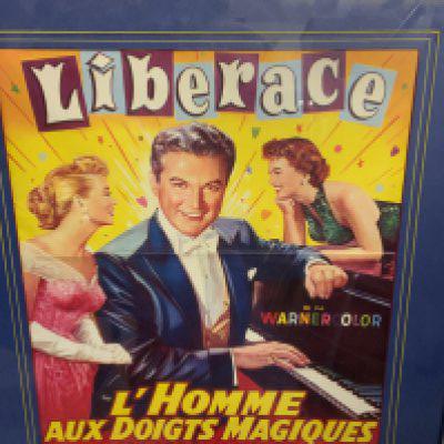 A mixed collection of framed posters, artwork etc.