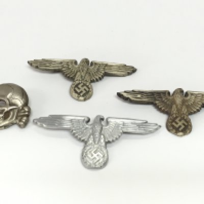 WW2 Nazi Germany cap badges including an SS skull and eagles, postage category A