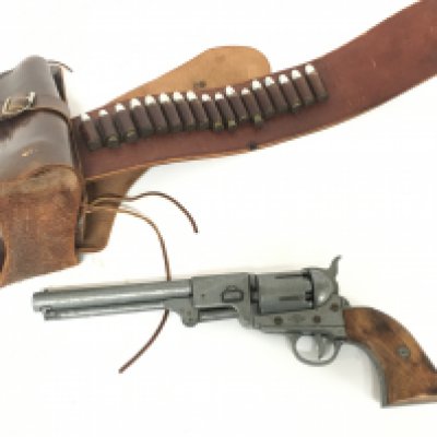 An inert wooden and metal replica of a Colt Army Revolver with a working mechanism, leather holster and dummy bullets