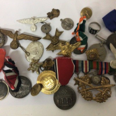 A collection of German third Reich medals and badges other military related buttons and badges some retrospective copys.