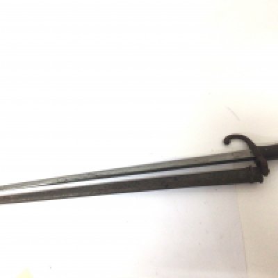 A French 1879 pattern bayonet the steel blade edge with an inscription.