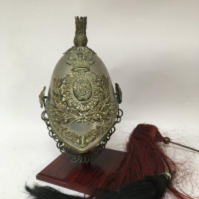 A Victorian Military brass mounted and metal helmet The Royal Dragoons. With chain Mail open link chin strap and two associated plumes.