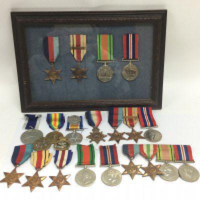 A collection of British WW1 and WW2 medals including 1939-1945, Africa, Italy, 1914-15 star, Africa star with North Africa 1942-43 clasp and other with a 1st army clasp, Naval victories of HMS Arethusa and HMS Lion medal etc. medals presented to J.H Candler CTN.ASST., This lot can be posted without the glass frame.
