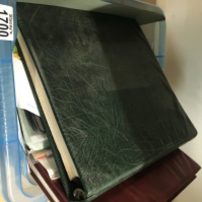 A box containing Channel island stamps