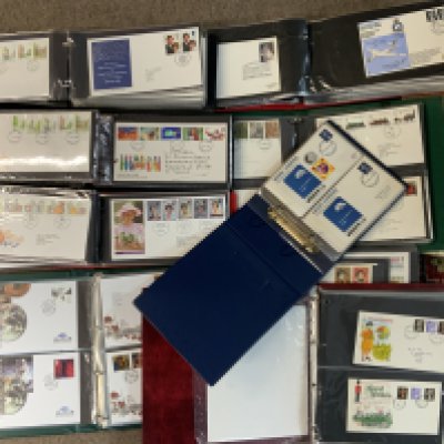 A large collection of 1st day covers and stamps. (D)