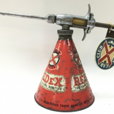 A vintage Redex oil squirter and redex car badge , 23cm tall. Postage category C