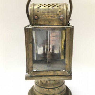 An early French brass car lamp by Albert Butin Paris. 27cm tall. This lot cannot be posted