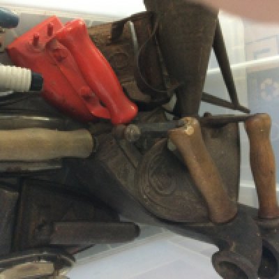 A box containing flat irons .