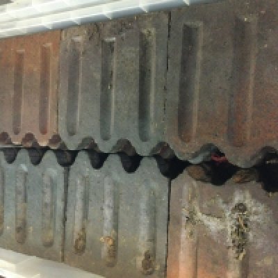 Two boxes containing garden boarder tiles.