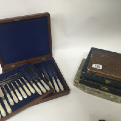 A mahogany cased set of silver plated and mother of pearl handled knifes and folks twelve place setting and four other cases of plated cutlery.