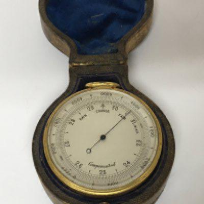 A Quality Victorian gilt metal pocket barometer and compass with makers stamp Singers patent. In a leather double sided case.