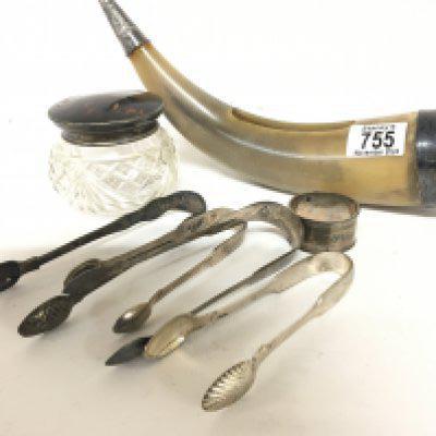 A collection of George III silver sugar tongs a silver and tortoise shell and cut glass jar a carved horn flower posy and other ornaments.