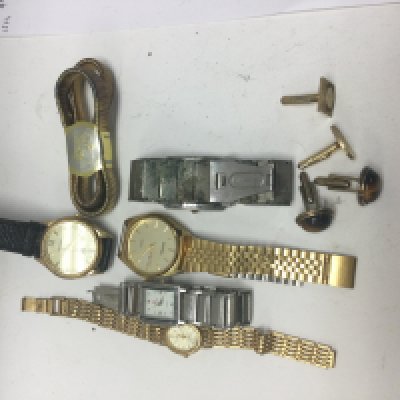 A collection of dress watches two pairs of cufflinks.